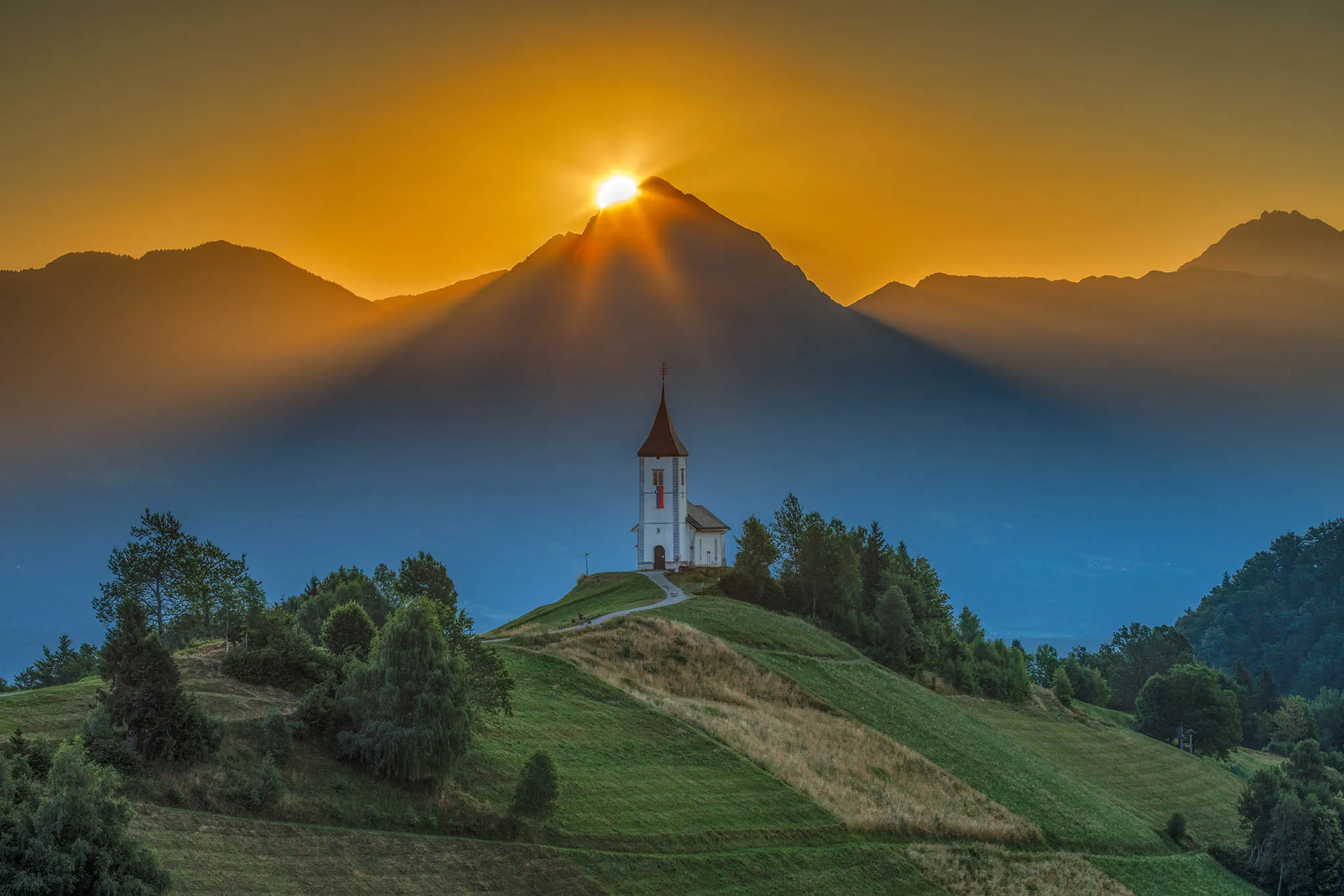 Sunrise over mountain peak, captured using exposure bracketing in Shutter+ and blended using Adobe Photoshop.
